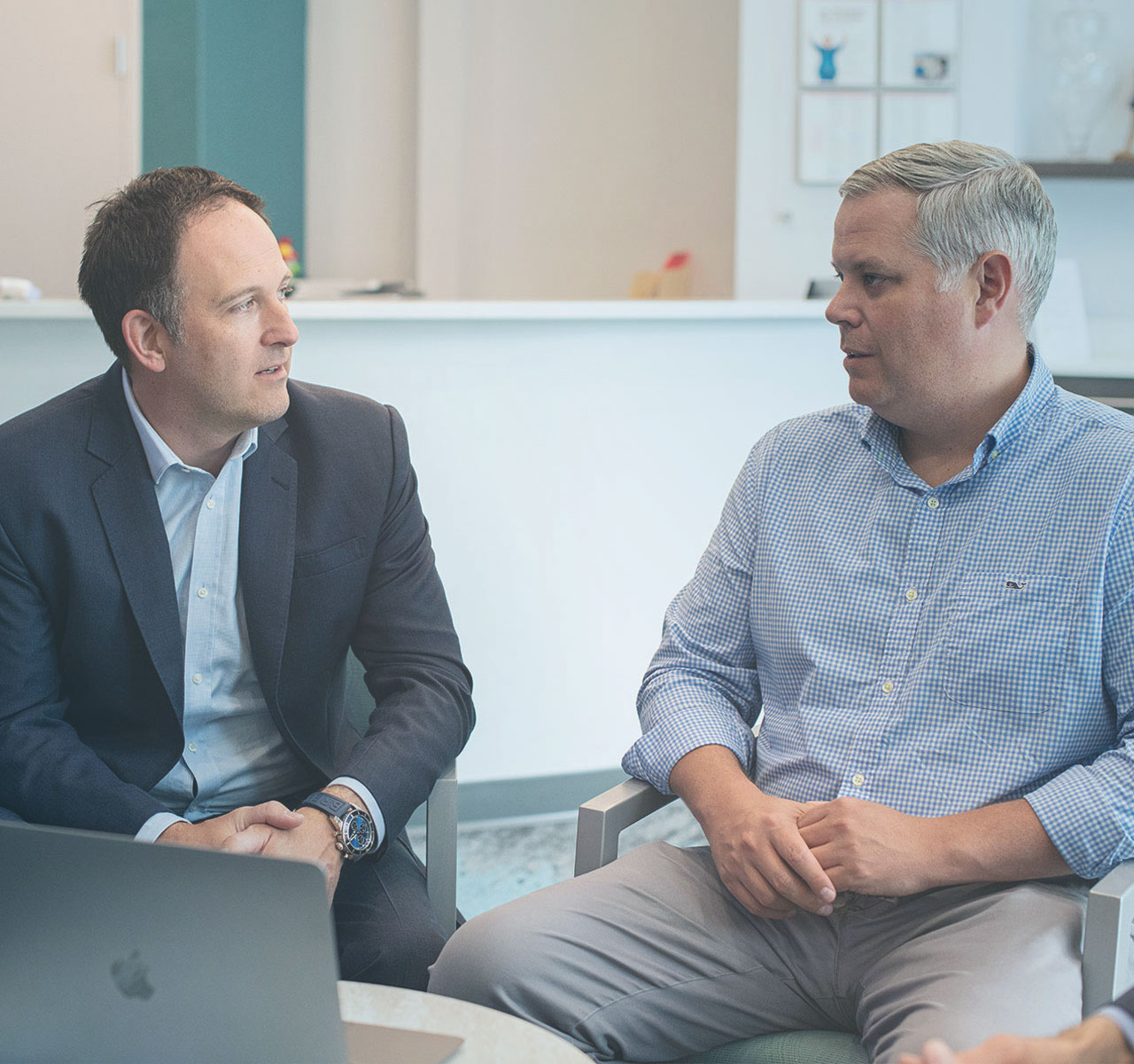 JW Advisory team members discussing practice valuation